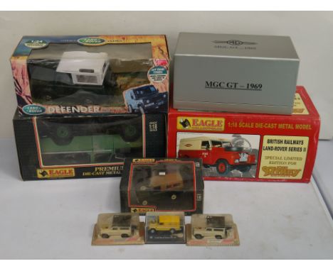 A collection of boxed diecast vehicles to include 1:18 scale Land Rover series II pick-up and a 1:18 scale Land Rover series 