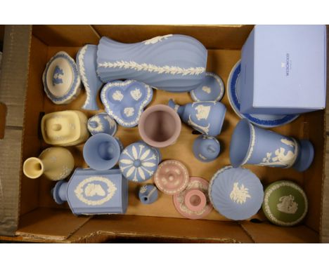 A mixed collection of Wedgwood Jasperware in multiple colours to include blue Jasperware tea caddy, lilac vanity items, green