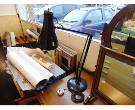 A black angle poise lamp