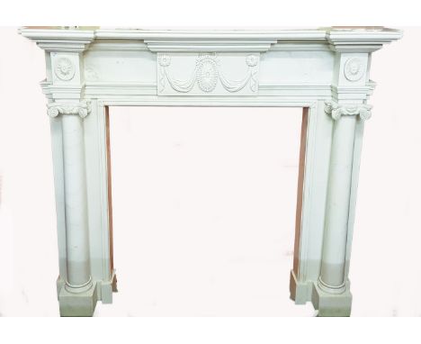 A VERY FINE WHITE CARVED STATUARY MARBLE MANTELPIECE, in the Adams style. The inverted break-front shelf with a moulded edge,