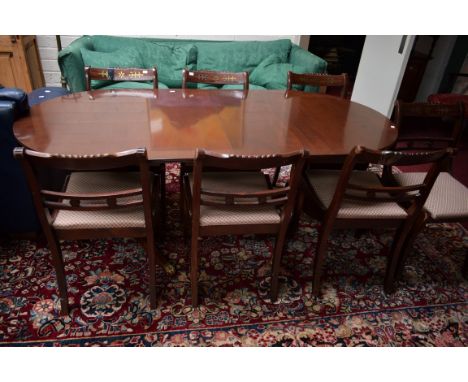 A REGENCY STYLE TWIN PEDESTAL MAHOGANY DINING TABLE, on two tripod pedestals. 6ft (183cm) long x 35" (89cm) wide. Together wi