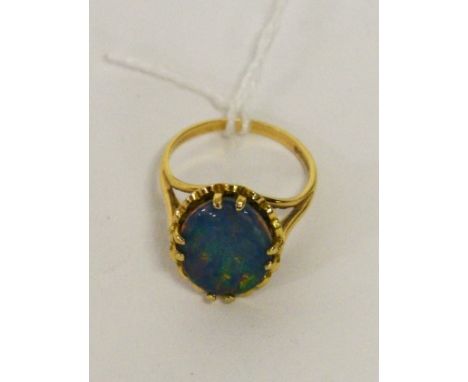 A 9CT GOLD OPAL DRESS-RING. Of oval form. 4.8g. (1) 