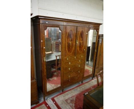 A VERY FINE EDWARDIAN INLAID PLUM PUDDING MAHOGANY WARDROBE. Dentil moulded cornice above a frieze inlaid with floral-swags a