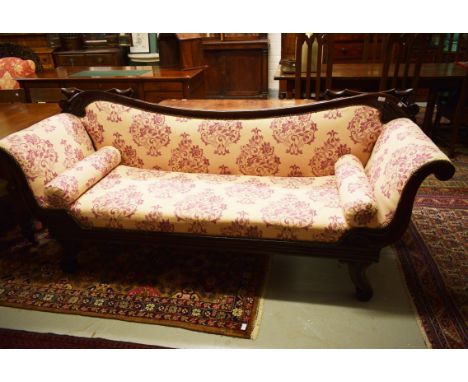 AN ATTRACTIVE LATE REGENCY PERIOD MAHOGANY SETTEE. With down curved moulded back, covered in attractive light floral pattern,