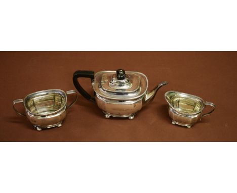 A THREE-PIECE SILVER TEA SERVICE, in the George III style. By Atkin Brothers, Sheffield. 1926. Comprising a twelve-sided tape