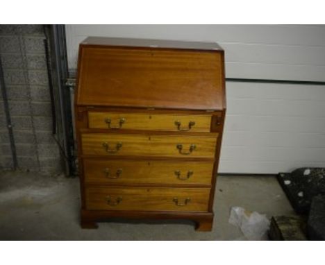AN INLAID AND CROSS BANDED MAHOGANY SLOPE-FRONT BUREAU, in the georgian style. O.R.M. The slope-front opening to reveal a fit