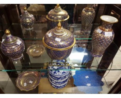 A HAND PAINTED THAI PORCELAIN BALUSTER SHAPED VASE, a large bowl and cover, a small bowl and cover and a tazza, profusely dec