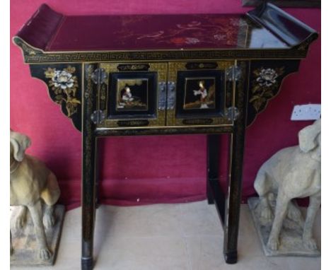 A CHINESE BLACK LACQUERED ALTAR TABLE. Scrolling sides and glass top, decorated in the Chinoiserie style. With birds perched 