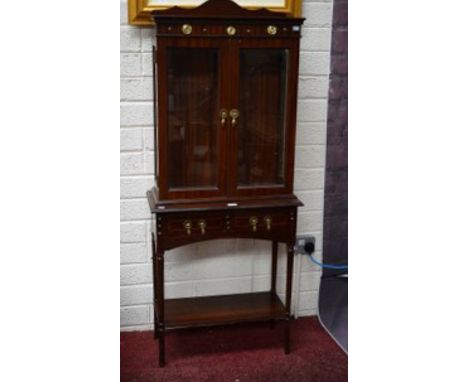 A MODERN TWO DOOR DISPLAY CABINET, on table base with two drawers and stretcher shelf. TOGETHER with a Chippendale style maho