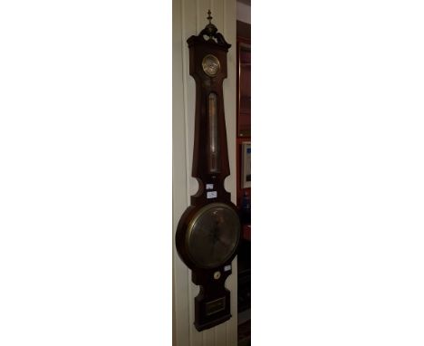 AN EARLY NINETEENTH CENTURY IRISH WHEEL BAROMETER, by Eamon C. Liver, Grafton Street, Dublin. Swan-neck pediment with centre 