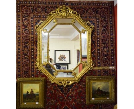 A BURGUNDY GROUND KASHAM CARPET, with navy centre medallion. All-over floral pattern with conforming spandrels, inside a wide