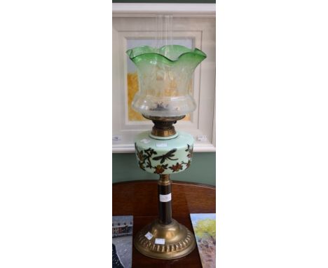 A BRASS AND LIGHT-BLUE GLASS OIL LAMP. Shade decorated with insects and fruit. Green etched shade. 22" (58cm) high. (1)