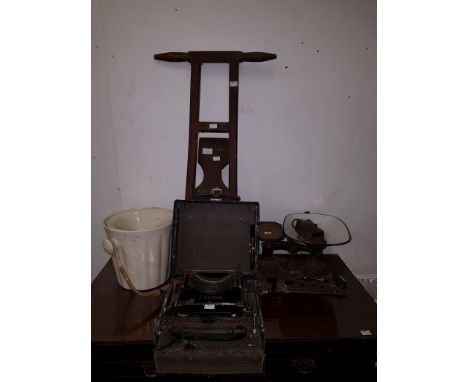 AN OLD WOODEN BOOT JACK, with two turned handles. AND an English cream-coloured toilet bowl with liner. AND an old cast iron 