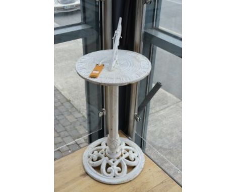 A CAST IRON SUNDIAL, of circular form. Raised on an octagonal stem with pierced circular base. 32" (82cm) high. (1)
