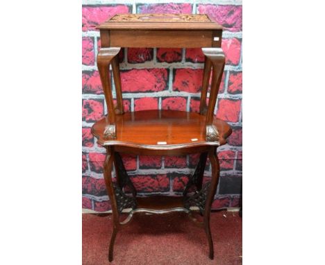 A SERPENTINE SHAPED MAHOGANY CENTRE TABLE, with stretcher shelf and shaped legs. Early twentieth century. 28" (71cm) wide. To