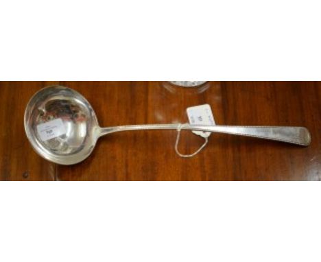 A FINE HEAVY IRISH PROVINCIAL SILVER SOUP-LADLE. By Carden Terry of Cork. c.1780. Of bead and taper pattern with large circul