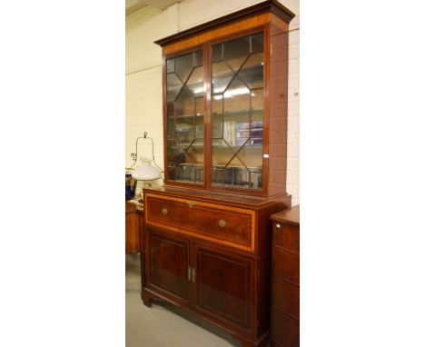 A FINE NINETEENTH CENTURY INLAID AND CROSS-BANDED MAHOGANY SECRETAIRE BOOKCASE.  Moulded cornice above a satinwood frieze and