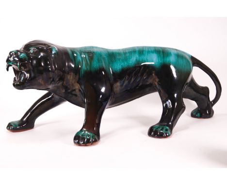 A large streaked Poole Pottery turquoise figure of a prowling tiger, 16cm high x 60cm