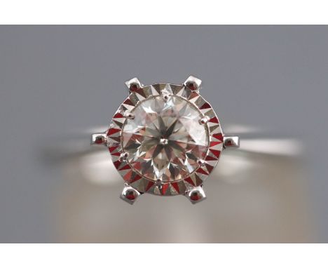 A white metal single stone ring. Set with a round brilliant cut stated to weigh 0.80cts.  Colour: K/L Clarity SI1/SI2. Hallma