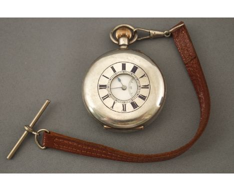 A demi hunter pocket watch. Manual wind movement, signed Hall and Co. Case hallmarked for silver 0.935. Case reference: 12356