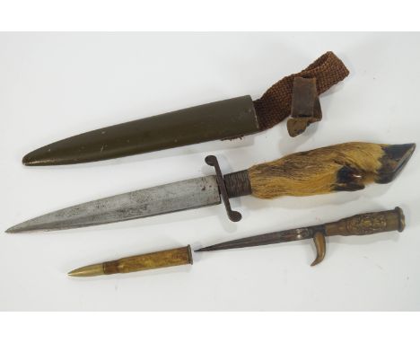 A deer slot knife, in scabbard,9cm long and a  trench art knife and scabbard, constructed from bullets, 14cm long