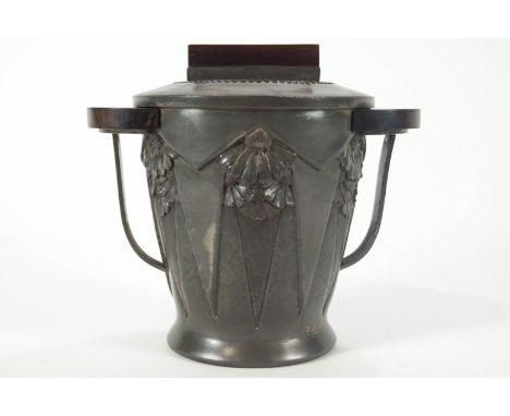 A pewter and rosewood mounted biscuit barrel and cover by R Setollis, Paris, impressed marks, 18cm high