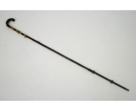 A 19th century parasol stick inset with an agate panel and gilt metal mounts, 90cm high