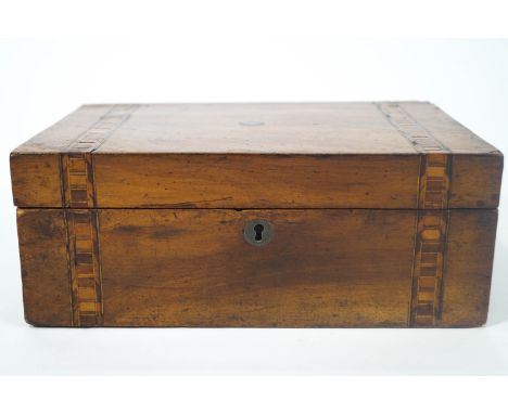 A 19th century walnut sewing box (lacking interior), the top with two parquetry bands, 29.5cm wide, together with a 19th cent