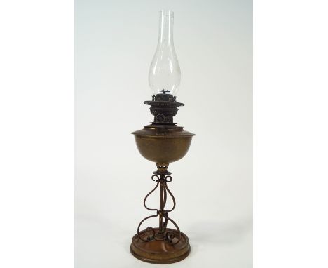 An Arts and Crafts style brass oil lamp, overall 69cm high