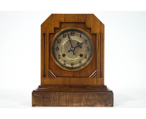 An early 20th century mantel clock in the Art Deco style enclosing a silvered dial, the movement striking of a gong, 29cm hig