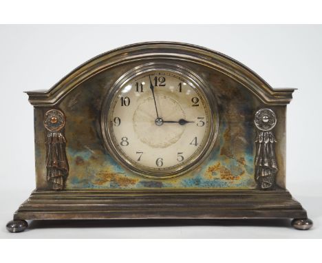 An early 20th century mantel clock in silver plated case on bun feet, 15.5cm high x 24cm wide