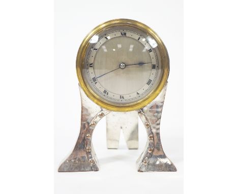 An Arts and Crafts style mantel clock, the French movement in silver plated case, marked WCSld, 16cm high
