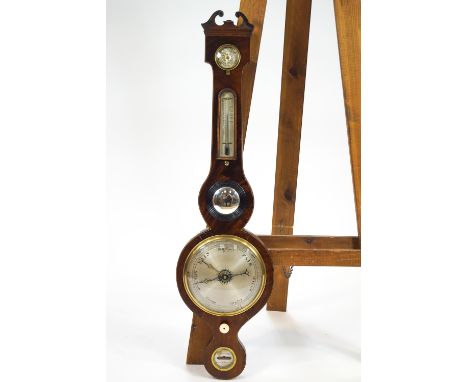 A Victorian mercury wheel barometer by G B Vismari of Bury St Edmunds of typical banjo form with thermometer, level and other