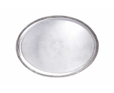 A George III Silver Tray,  by Robert Garrard, London, 1805 oval and on four tapering panel feet, the rim and feet each gadroo