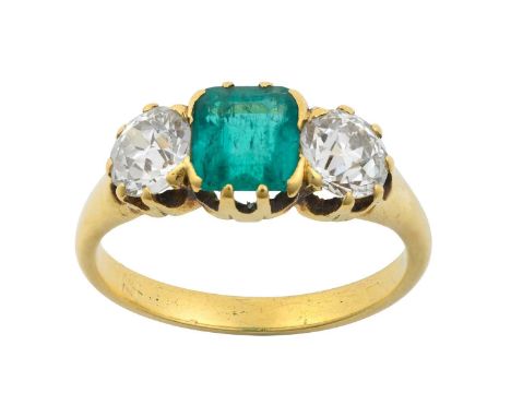 An Emerald and Diamond Three Stone Ring the emerald-cut emerald flanked by old cut diamonds, in yellow claw settings, to a pl