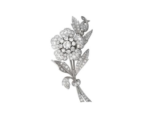 A Diamond Brooch/Pendant realistically modelled as a floral spray, set throughout with round brilliant cut and eight-cut diam