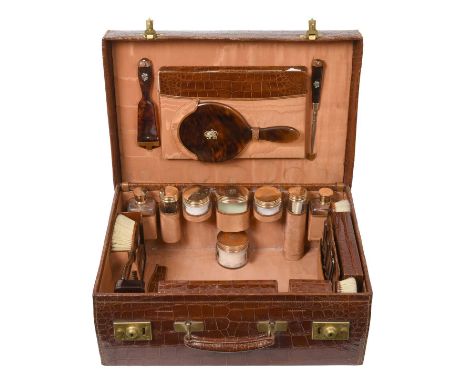 A George V Gold and Tortoiseshell-Mounted Dressing-Table-Service,  by Asprey and Co. Ltd., London, 1919, 18ct each piece plai