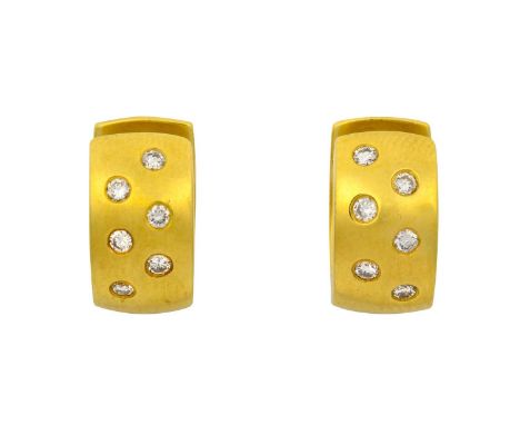 A Pair of Diamond Earrings the yellow hinged cuff inset with six round brilliant cut diamonds to the front section, total est