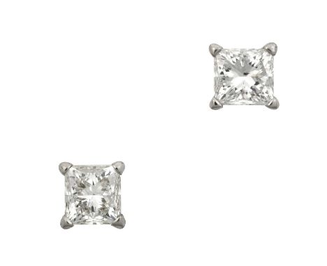 A Pair of Diamond Solitaire Earrings the princess cut diamonds in white four claw settings, total estimated diamond weight 1.