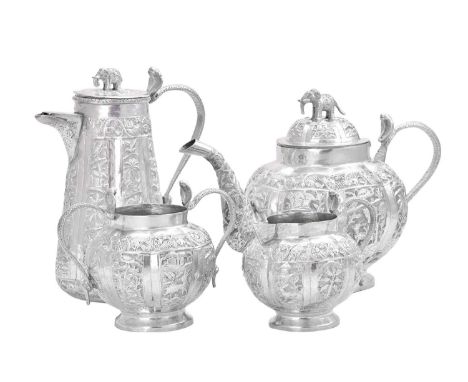 A Four-Piece Indian Silver Tea-Service,  Apparently Unmarked, Circa 1900 each piece tapering or baluster, the sides with pane