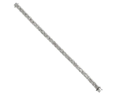 A Diamond Line Bracelet thirty-one clusters formed of a princess cut diamond within a border of alternating baguette cut and 