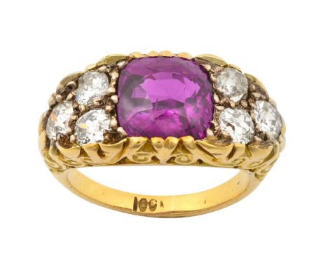 A Pinkish-Purple Sapphire and Diamond Ringthe cushion cut pinkish-purple sapphire flanked by trios of old cut diamonds, in wh