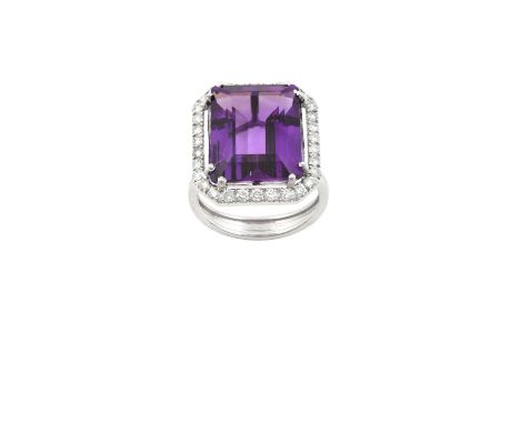 An 18 Carat White Gold Amethyst and Diamond Cluster Ringthe emerald-cut amethyst within a border of round brilliant cut diamo