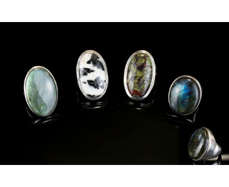 A Collection Of Silver And Crystal Set Statement Rings A collection of four large oval rings, each handmade and mounted in si