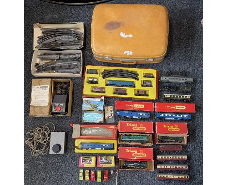 Collection of Tri-ang Hornby Model Railways Trains, Train Tracks and others, along with a vintage suitcase. 