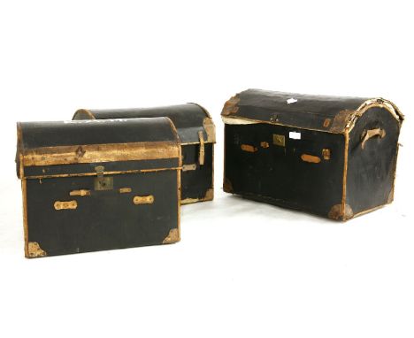 A pair of vintage dome topped trunks, with brown leather detailing, 76 x 56 x 62cm, together with a matching larger example 9