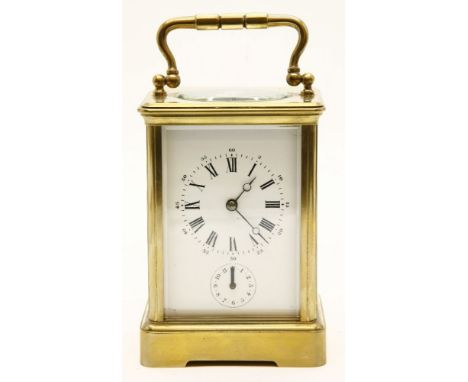 A 20th century French brass and fire glass carriage alarm clock, the white dial with black Roman and Arabic numerals, and sub