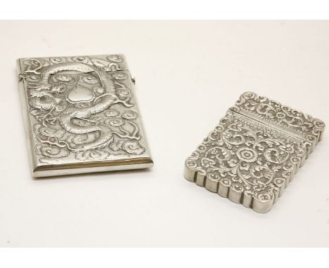 A Chinese silver card case,  embossed with a dragon one side, bamboo the other, 10.5cm high, and an Indian card case, 8.5cm