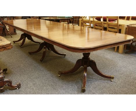 A Regency style mahogany triple pedestal dining table, complete with three additional leaves* This lot will be sold with VAT 