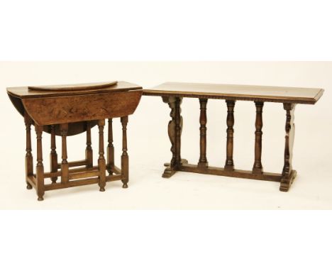 A Jacobean style low table, with shaped supports to either end, united by plasters and a stretcher, 120 x 55 x 65cm, together